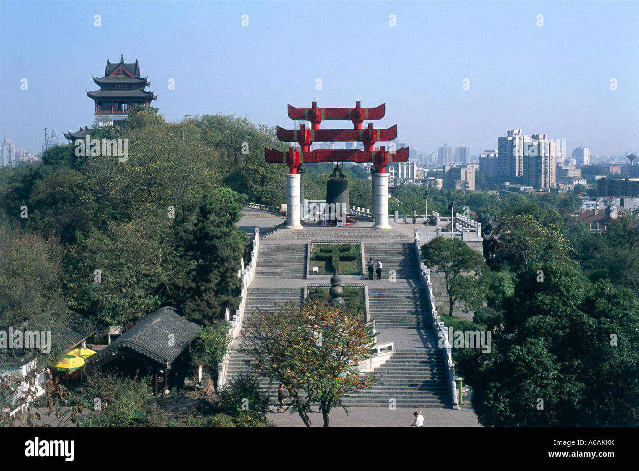 China, Wuhan, Yellow Crane Pavilion, old bronze pinnacle on She Shan south of Yangzi in Wuchang district, with modern skyline Stock Photo