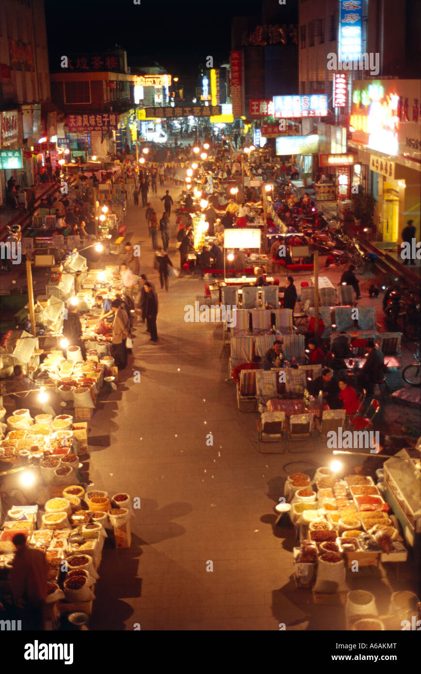 China, Gansu, Dunhuang, Dong Dajie, fresh produce, souvenir night market,  food stalls, spices, silks and carpets Stock Photo