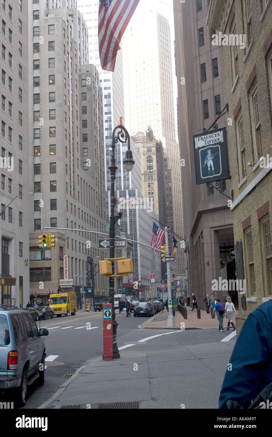 Broad Street Manhattan with sign for Fraunces Tavern  near Wall Street NY NYC USA Stock Photo