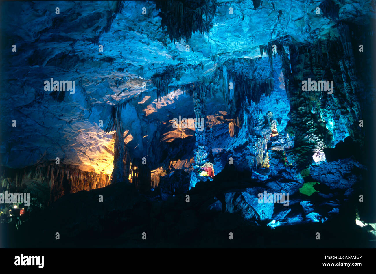 China, Guangxi, Guilin, Guangming Hill, Ludi Yan (Red Flute Cave), colorfully illuminated hall in cave limestone formations Stock Photo