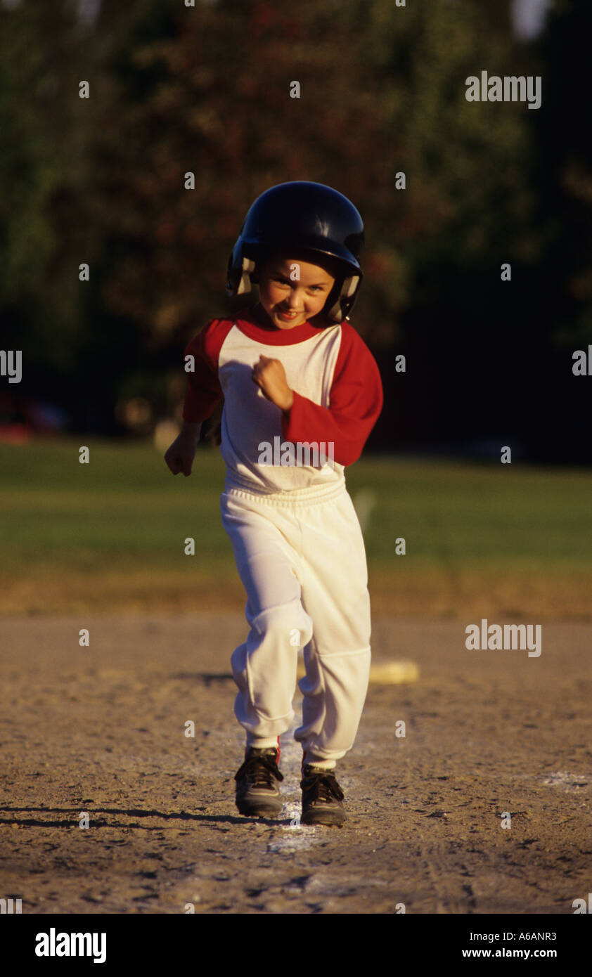 Young girl running bases during game sunset light Woodinville