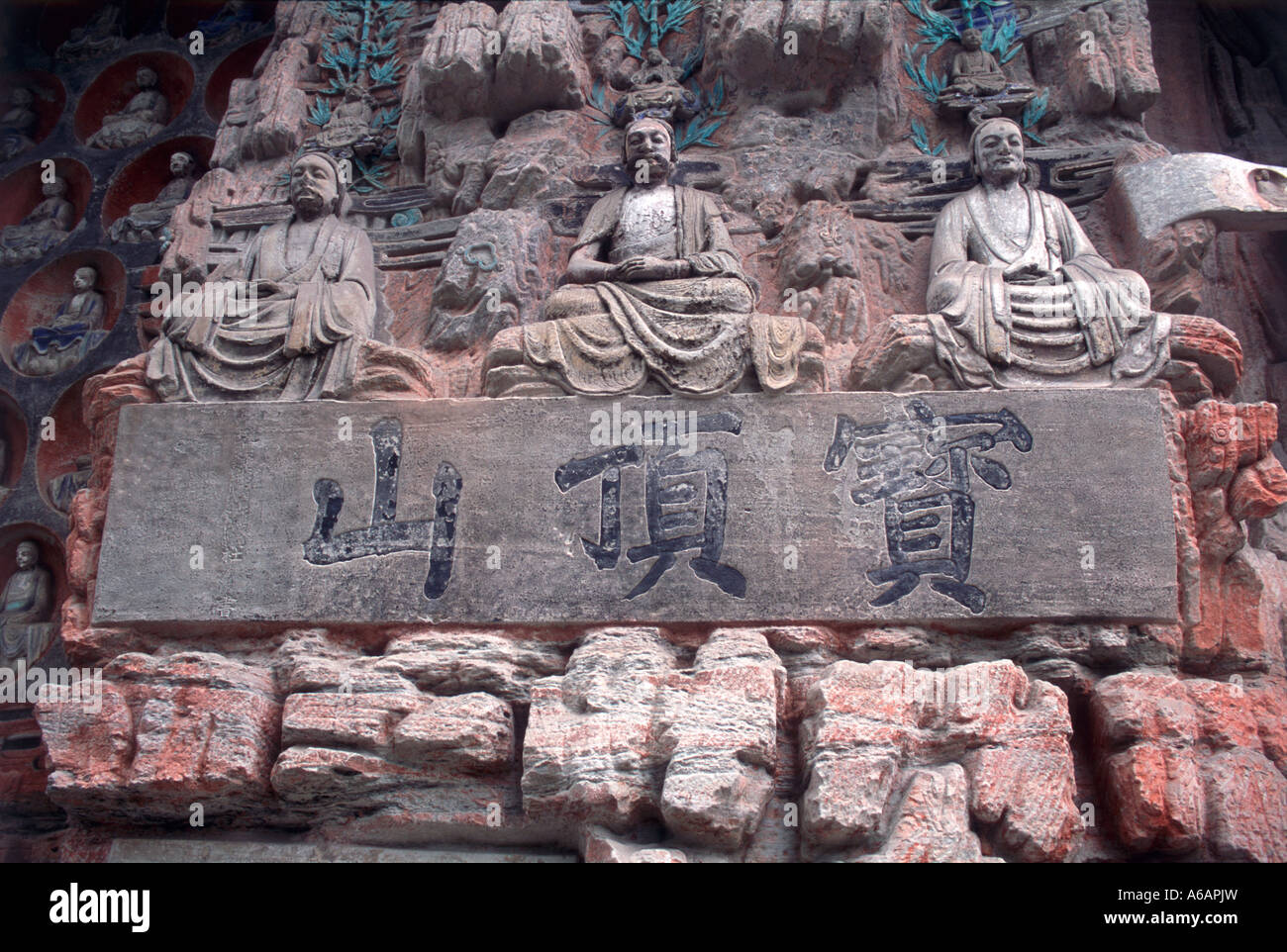 China, Sichuan, Dazu, Baoding Shan, Cave 4, Three Sages, three serene figures sit in eternal contemplation of life, the infinite Stock Photo