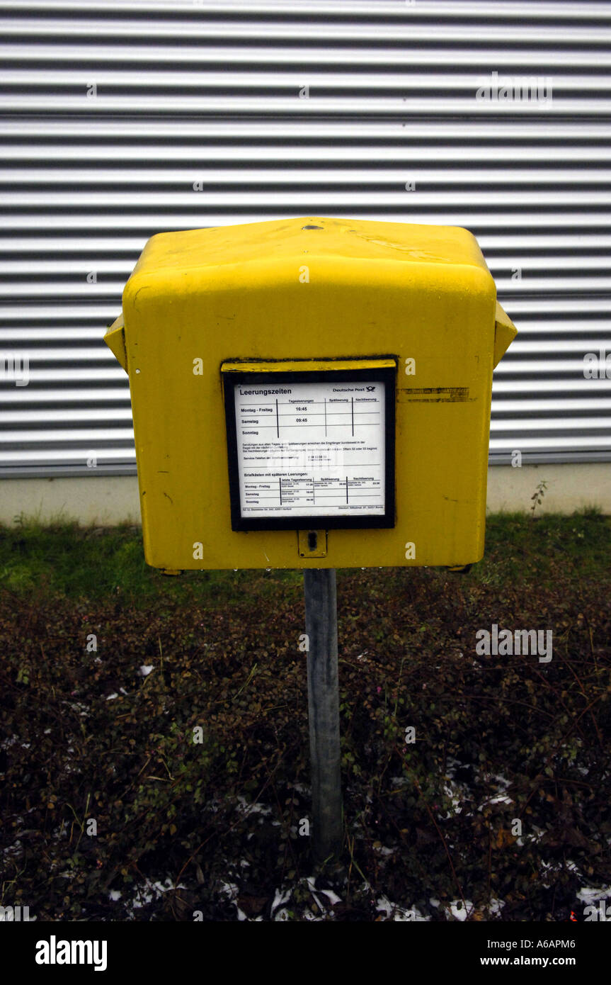 yellow post box german germany deutsch deutschland europe european eec eu  vertical colour color post postal service europe Stock Photo - Alamy