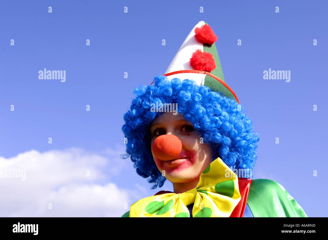 carnival karneval clown kid girl youth female lass funny humour comic  dressing up fancy dress costume day daylight blue sky happ Stock Photo -  Alamy