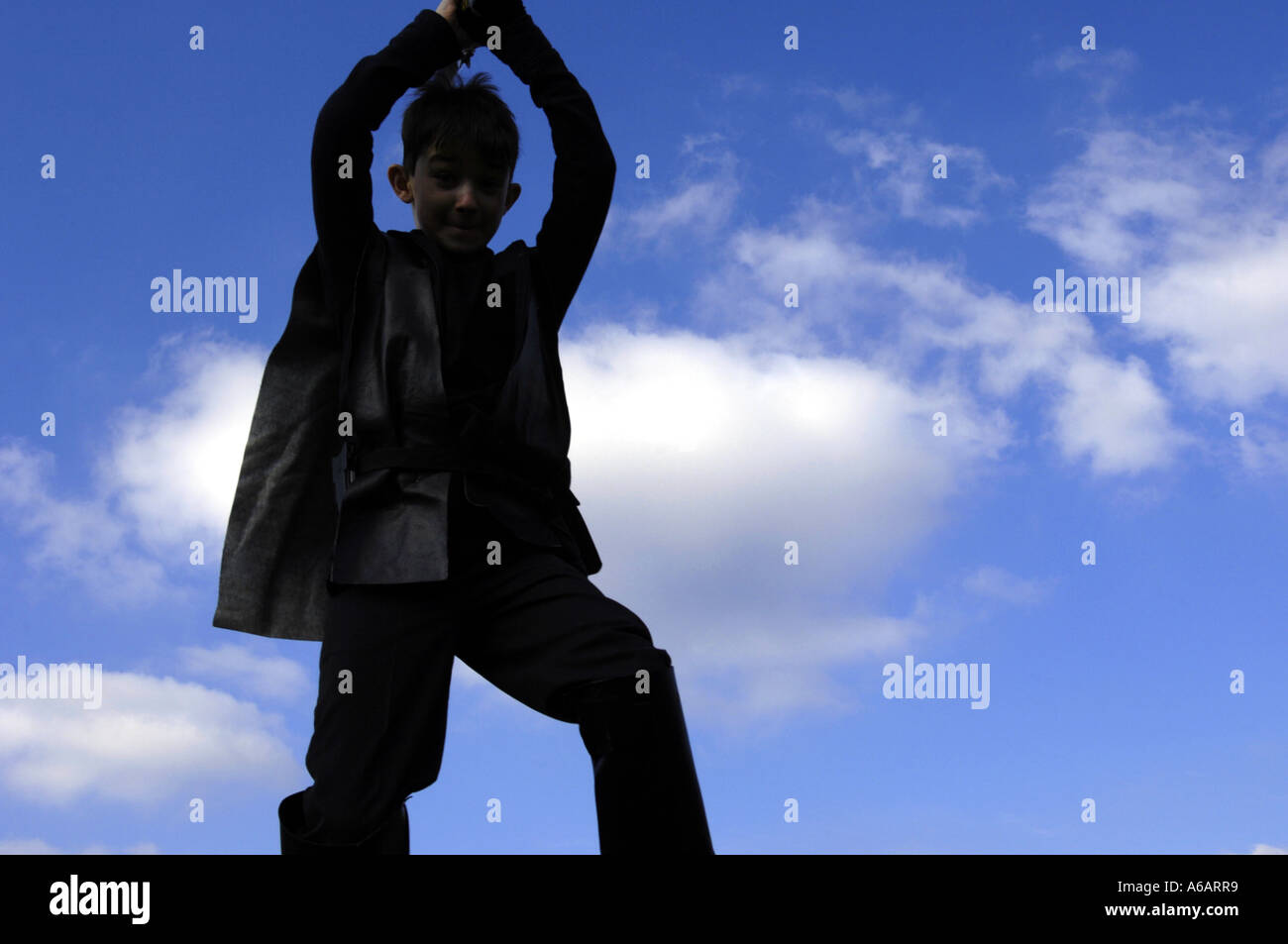 boy blue sky above pretending to be darth vader Stock Photo - Alamy