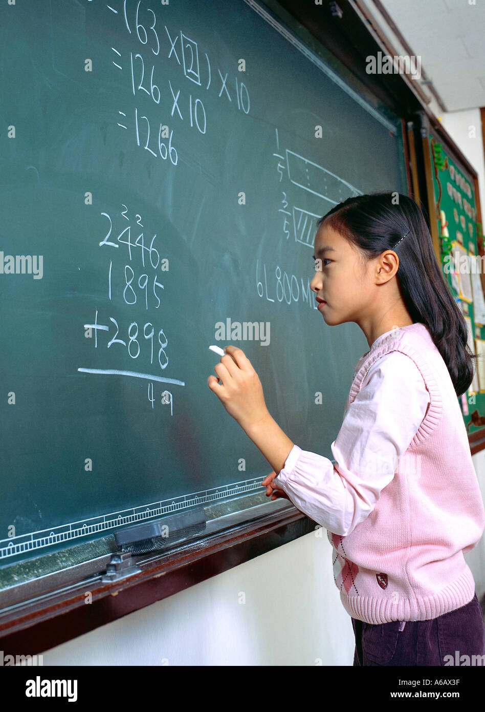 Hi In Math Girl writing math in class hi-res stock photography and images - Alamy