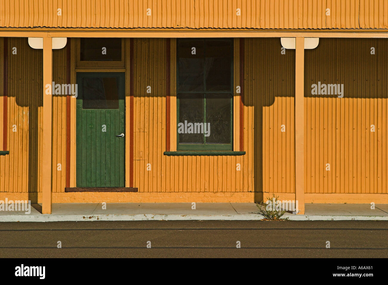 Yellow tin house Stock Photo - Alamy