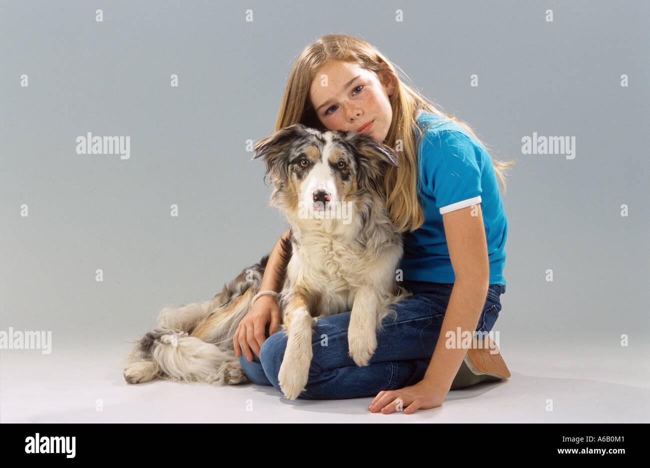 girl with Australian Shepherd dog Stock Photo