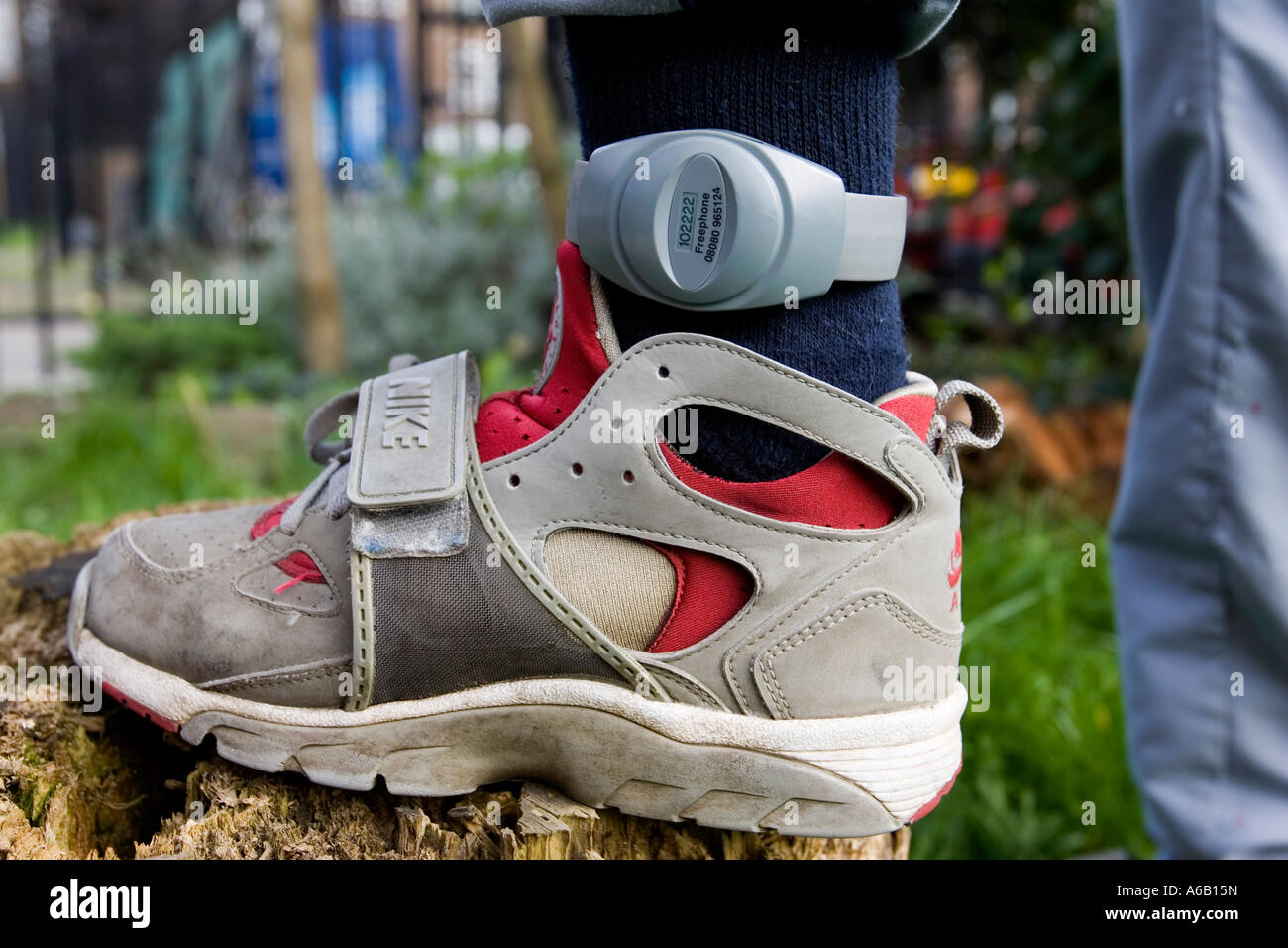 Electronic tag applied to a young offender ankle London England Britain UK Stock Photo