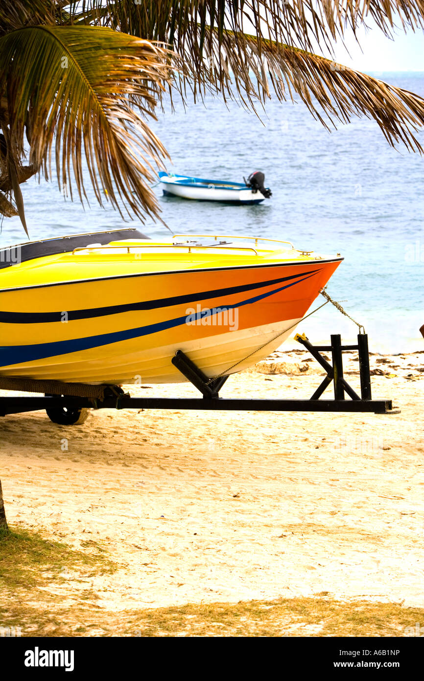 Yellow Speed boat 'Storm' on trailer in Mauritius Stock Photo