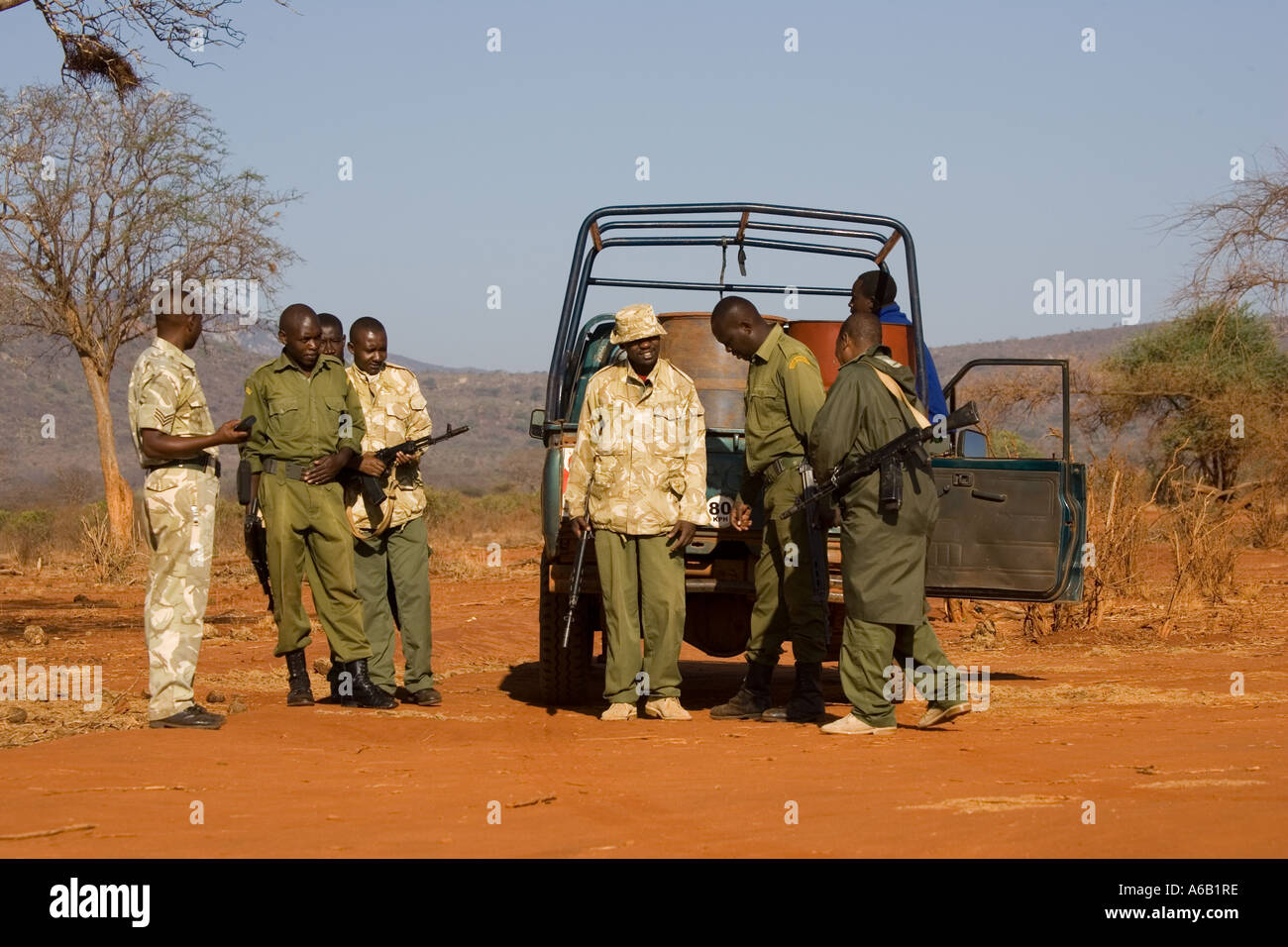 Warden briefing rangers leaving foot patrol in Ngulia Rhino Sanctuary Tsavo West National Park Kenya Africa Stock Photo