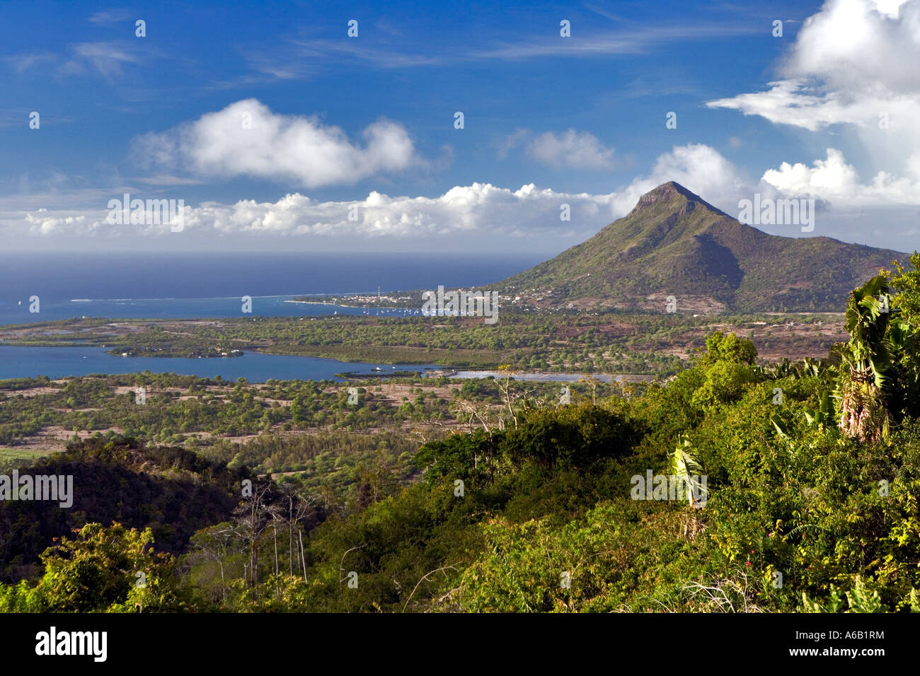 Spectacular scenery with distant mountain and sea - Mauritius Stock Photo