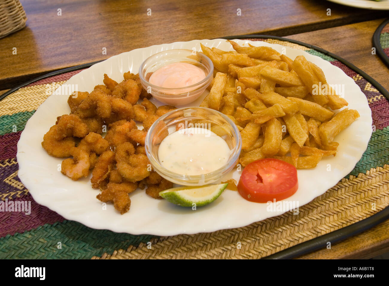 Plate of deep fried prawns and chips at The Moorings floating