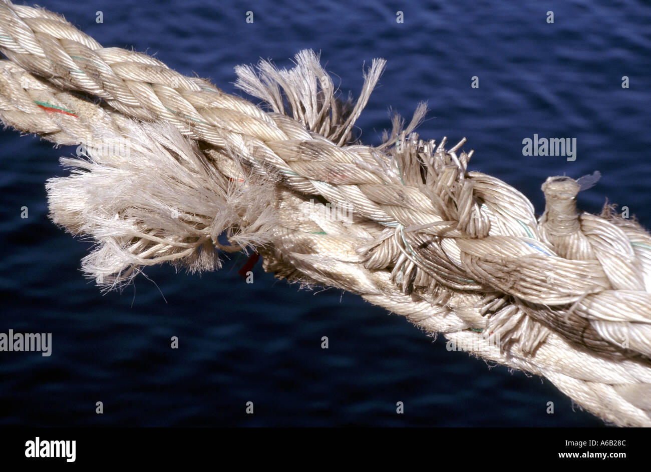 Frayed rope dockside ship mooring rope concept image Frayed at the