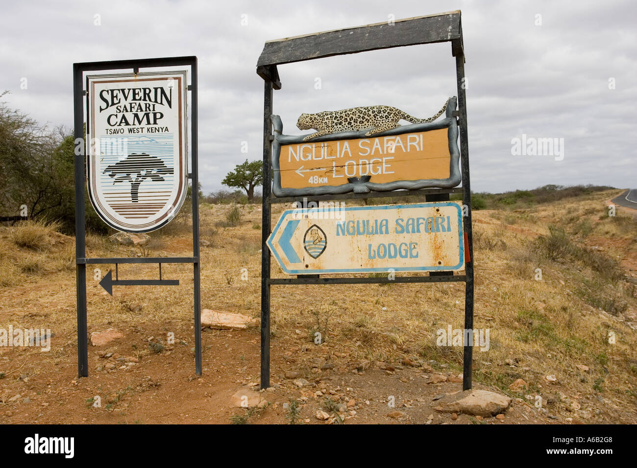 Tour lodge signboards at entrance gate to Tsavo National Park West ...