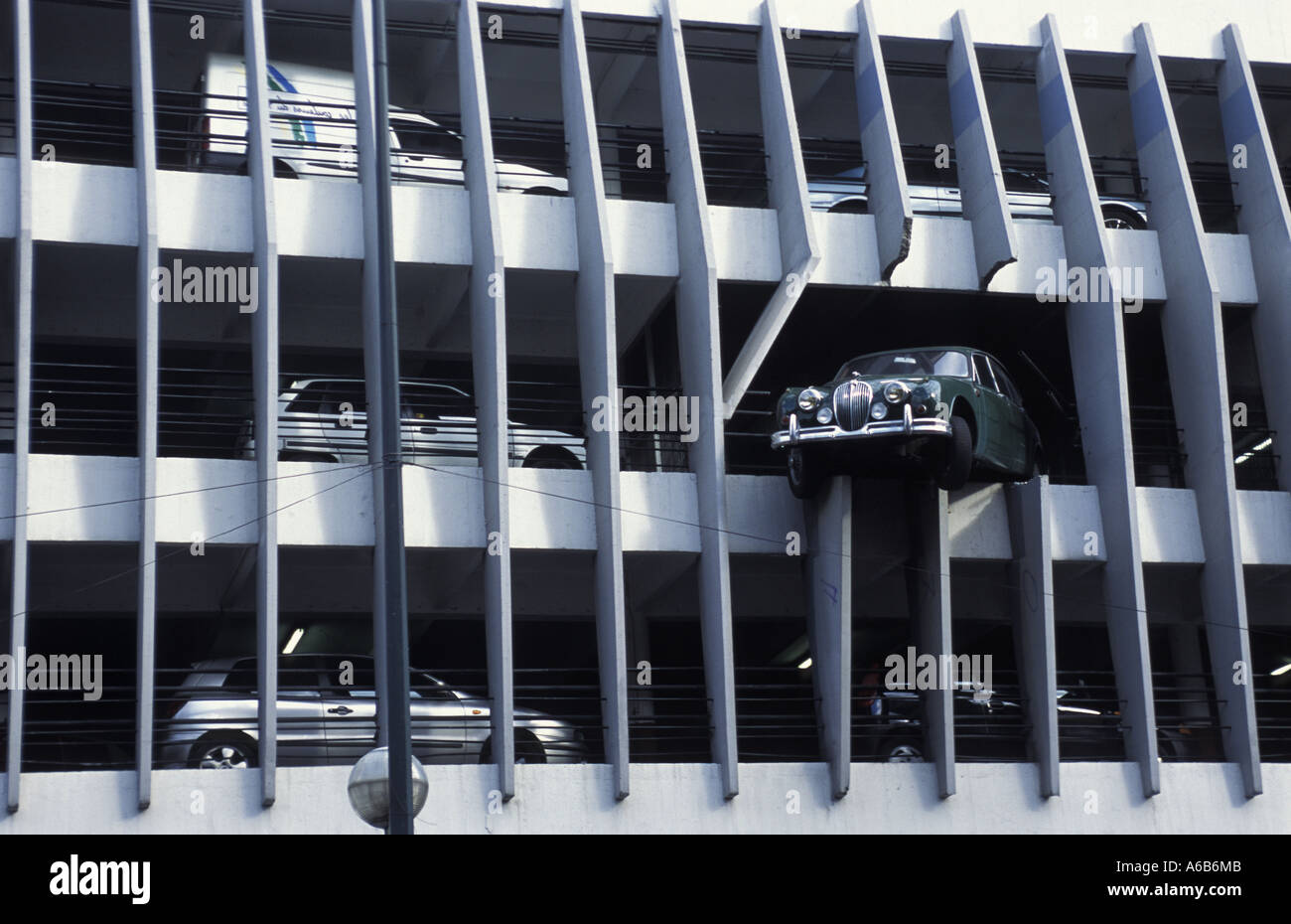 Car overhanging multi-storey car park, Bordeaux, France Stock Photo