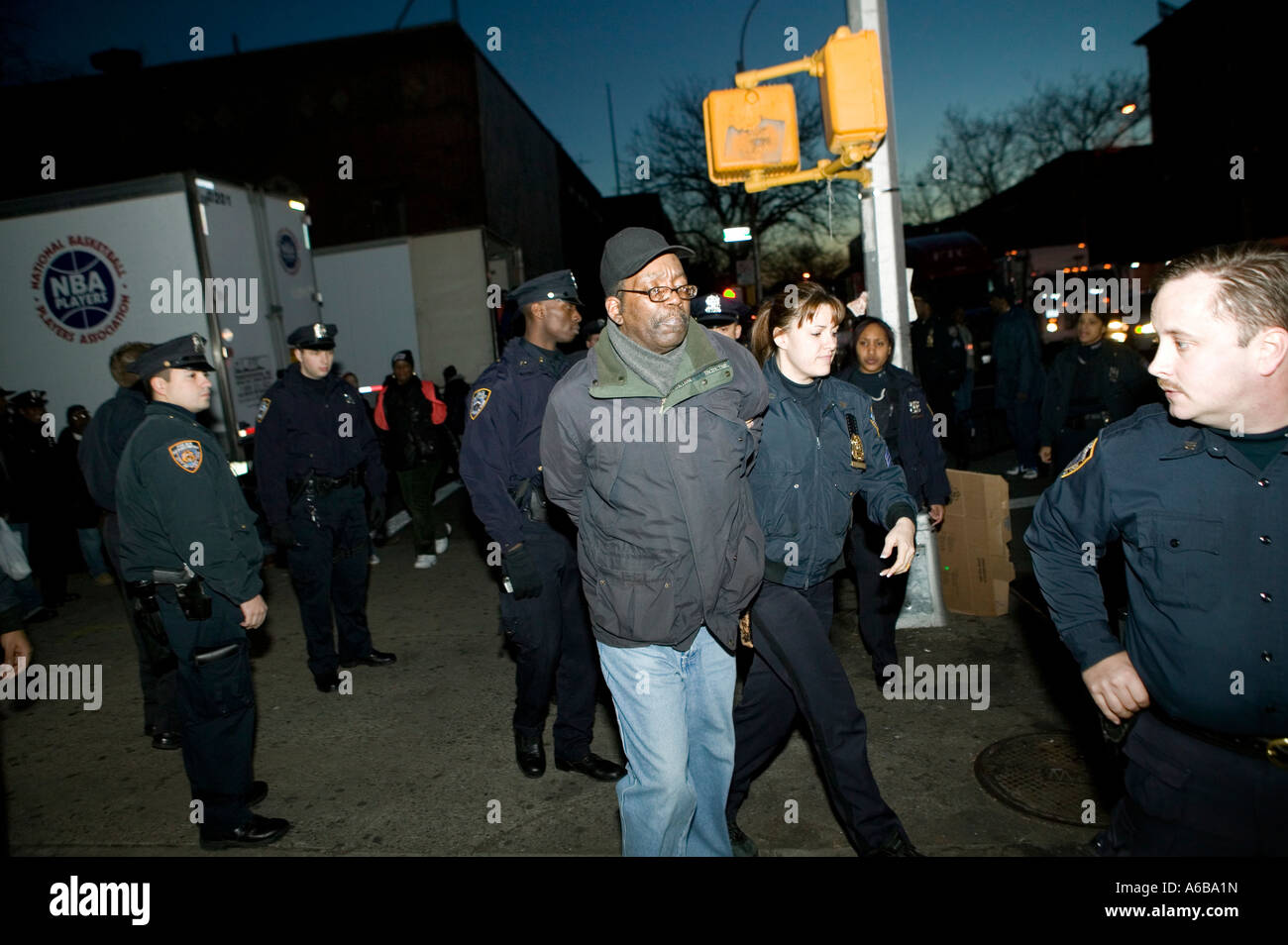 NYPD police officers arrest a man in New York Cty USA Dec 2006 Stock Photo