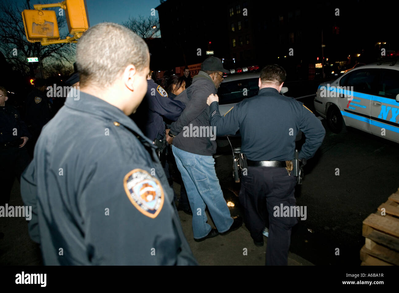 NYPD police officers arrest a man in New York Cty USA Dec 2006 Stock Photo