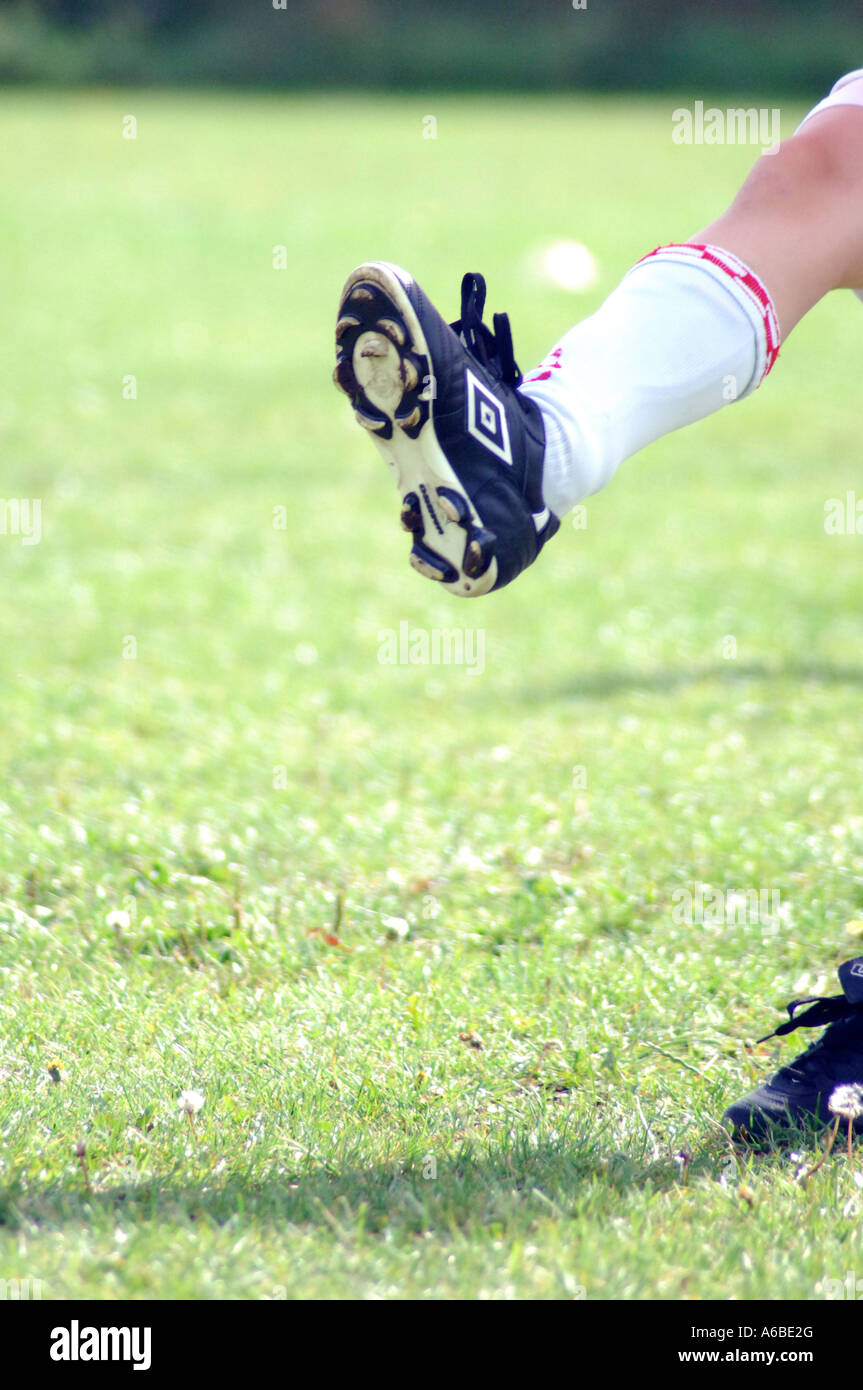 British school boy playing football London UK Stock Photo Alamy