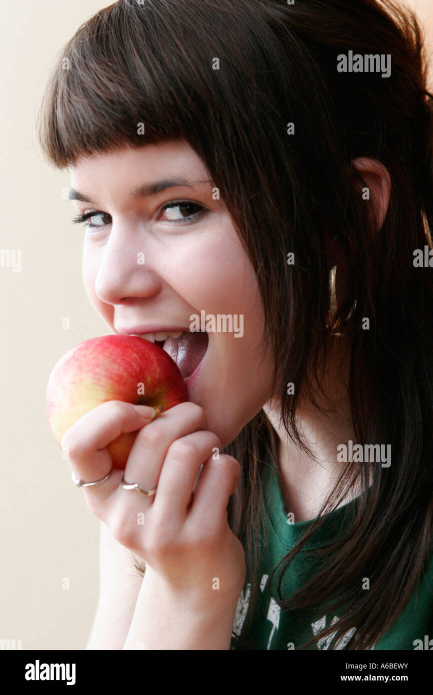teenage girl eating apple Stock Photo
