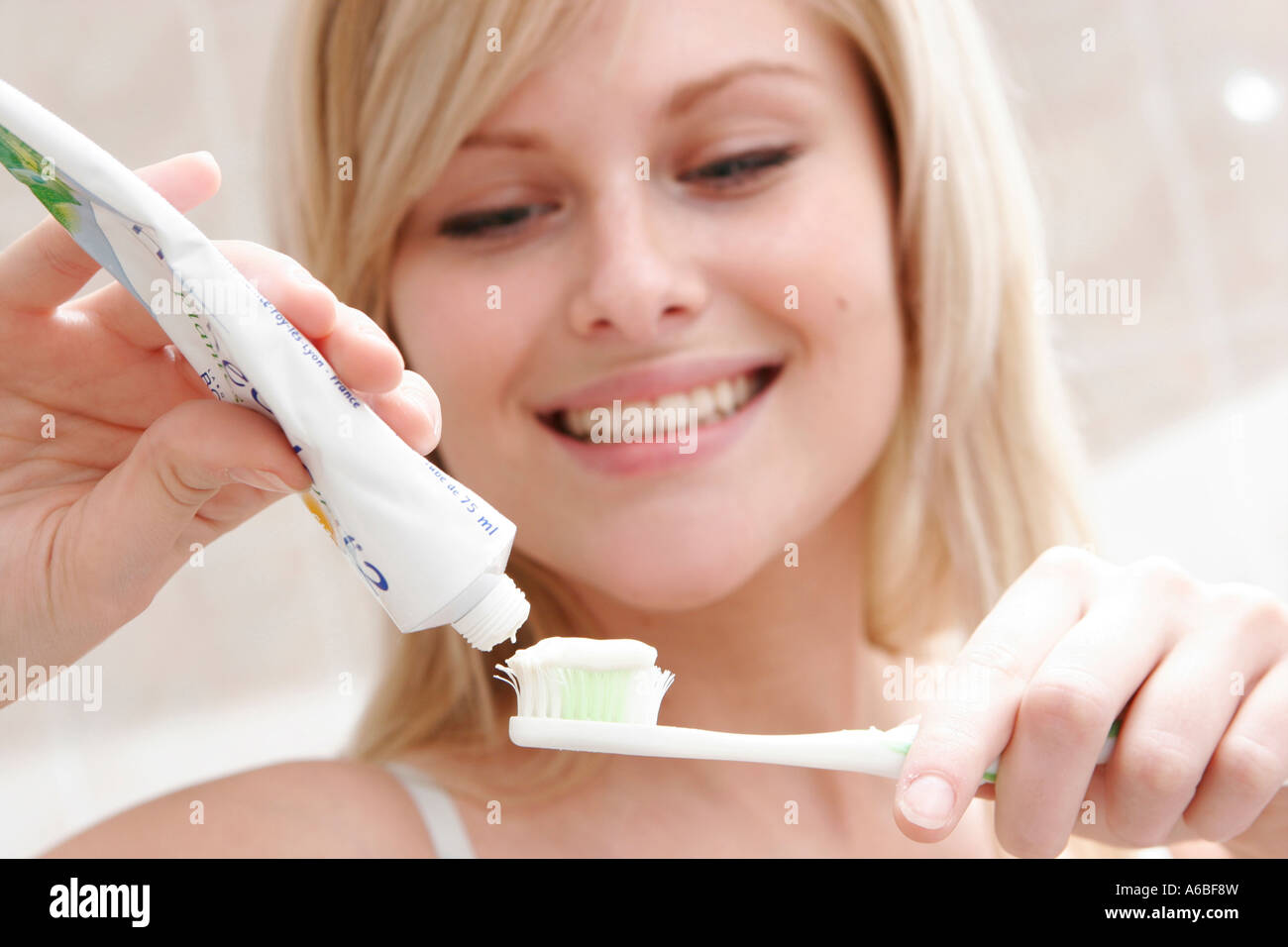 Woman brushing her teeth Stock Photo