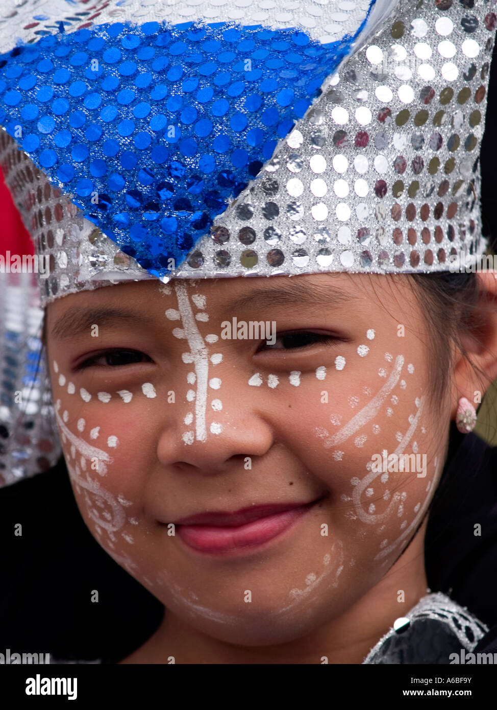 cute girl with painted face and sparkling Sinulog Festival Cebu