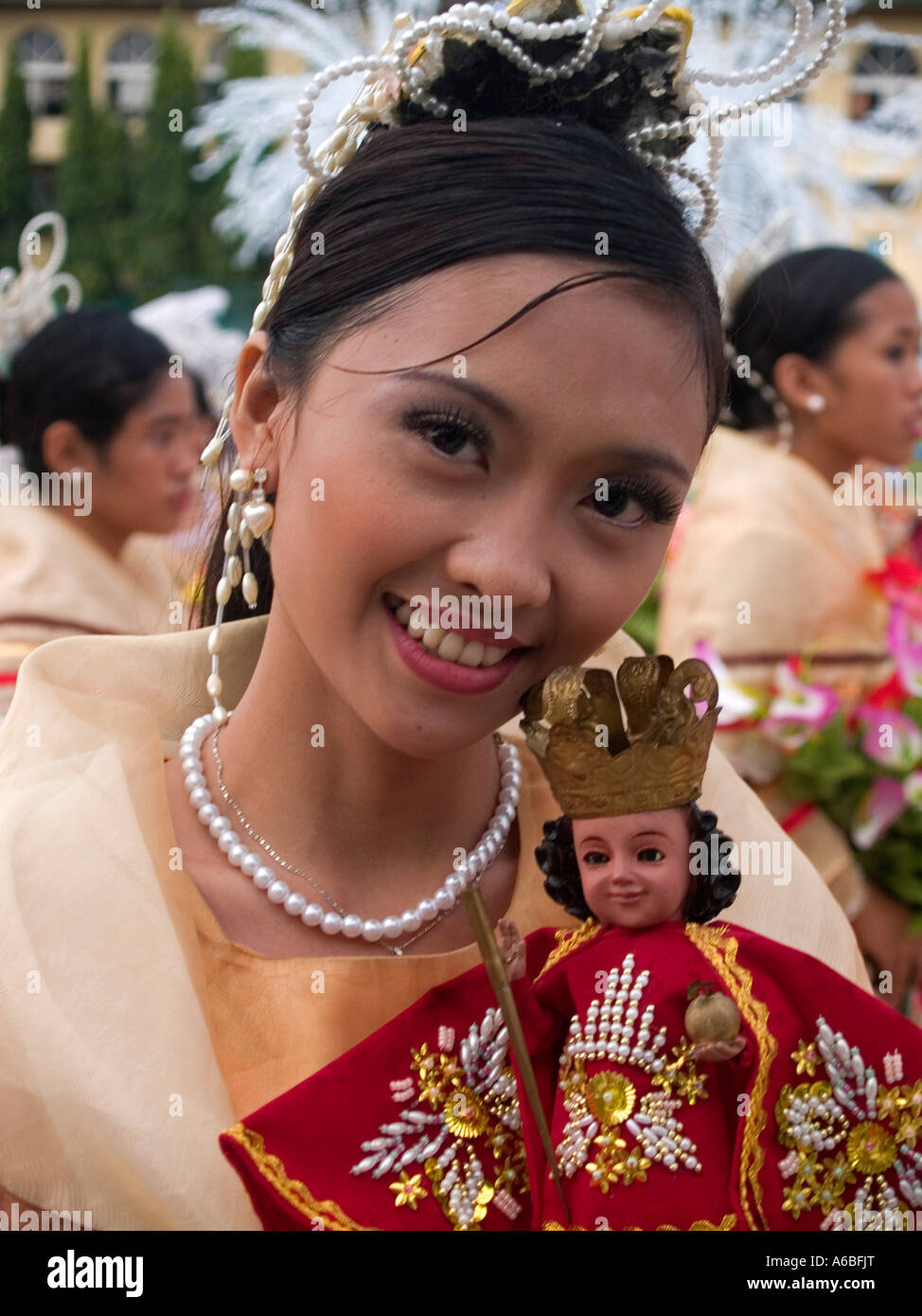 beauty with St Nino doll at the Sinulog Festival Cebu Philippines Stock