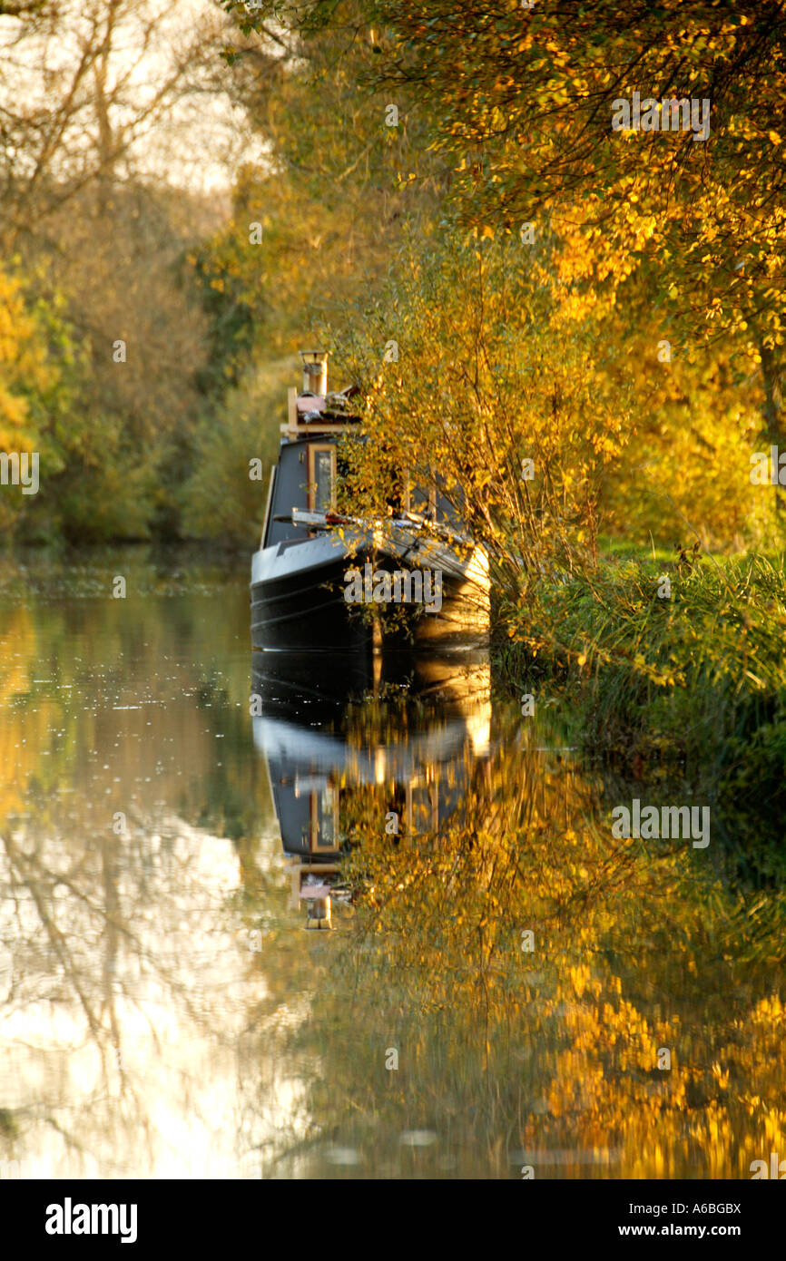 Barge moored on the Kennet and Avon Canal at Padworth in Berkshire on a bright and sunny day in late autumn Stock Photo