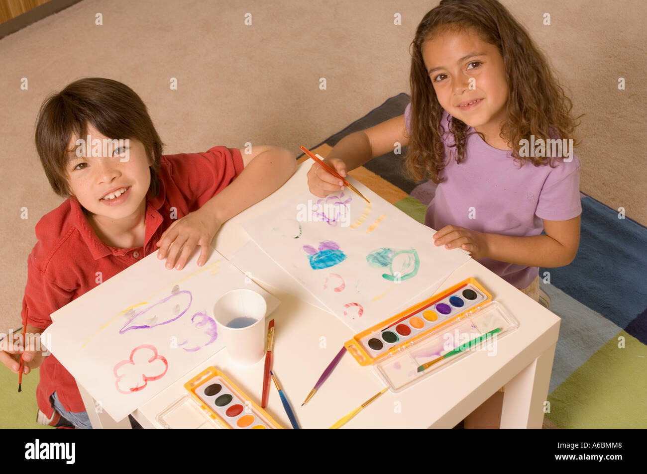 Portrait of children with water colors Stock Photo
