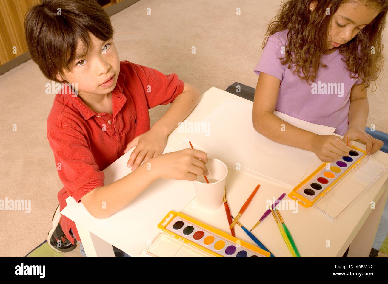 Portrait of children with water colors Stock Photo