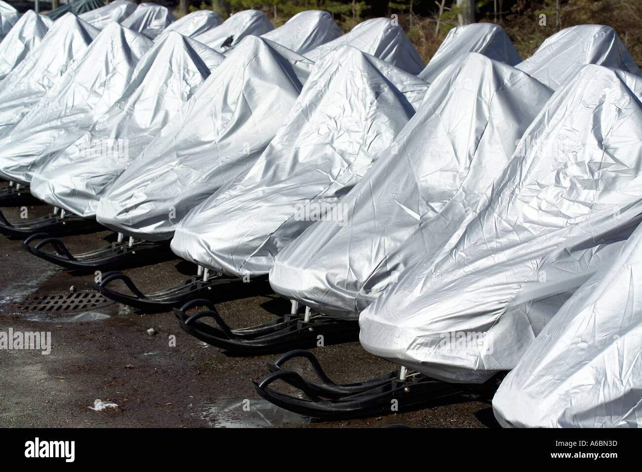 snow mobiles under cover Stock Photo