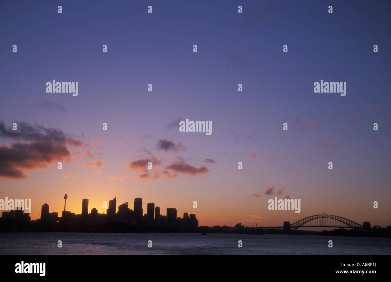 Sunset over Sydney skyline and Sydney Harbour Bridge Sydney New South ...