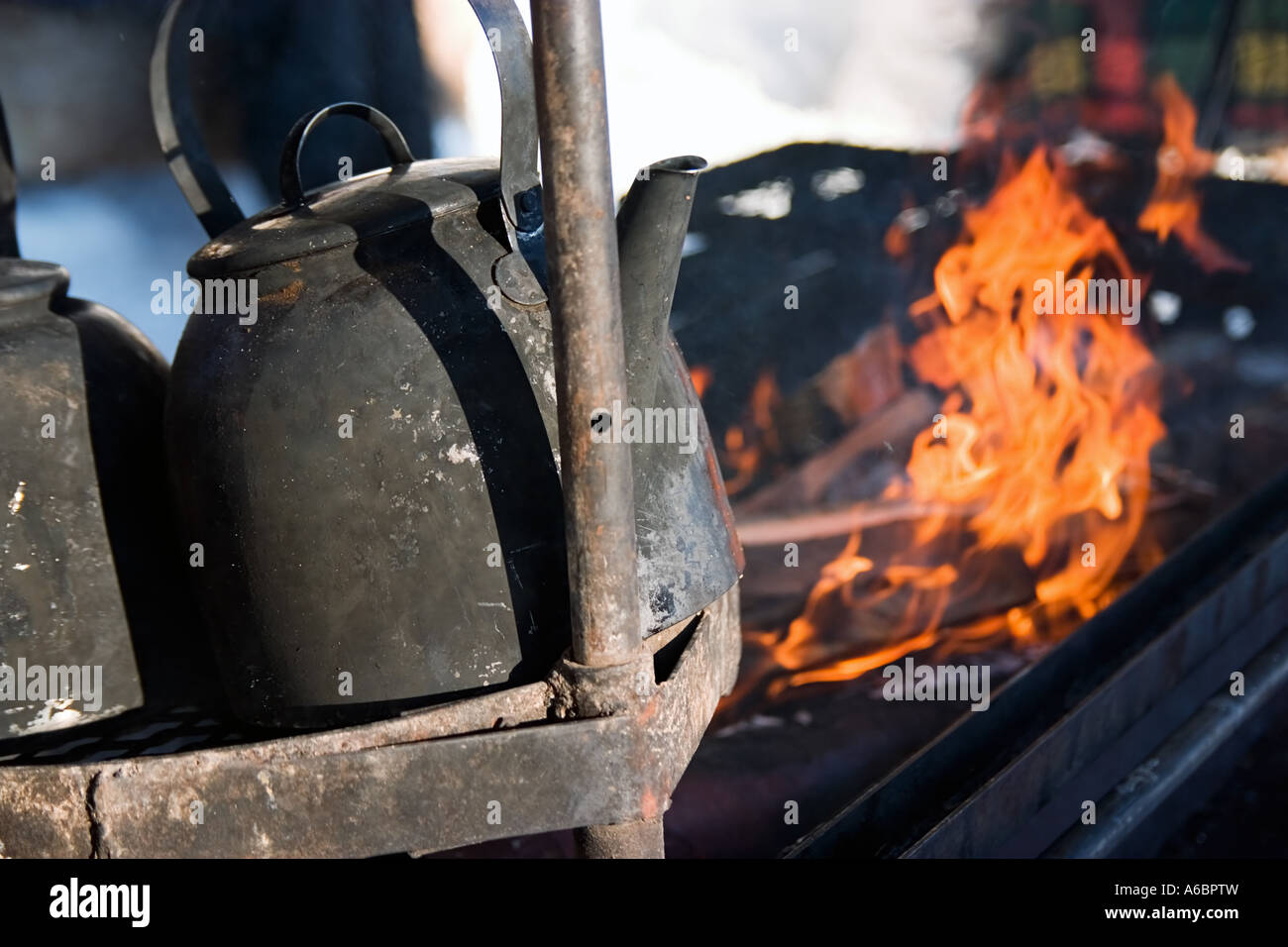 Black Kettles brewing on an open campfire Stock Photo Alamy