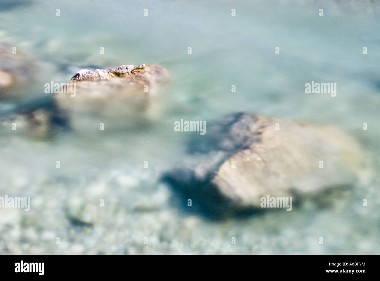 Water flowing around rocks hi-res stock photography and images - Alamy