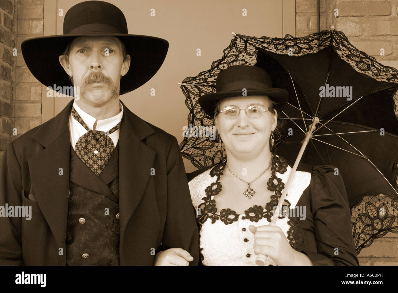Sepia toned portrait of actors dressed as Wyatt Earp and his wife Josephine. Stock Photo