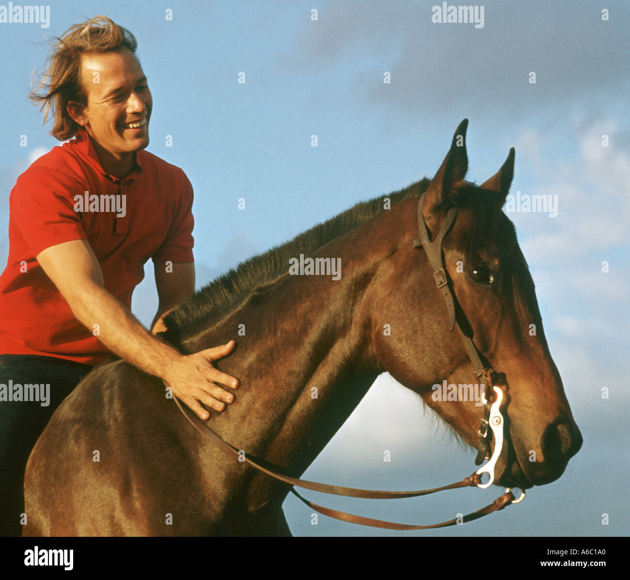 mand riding horse Stock Photo