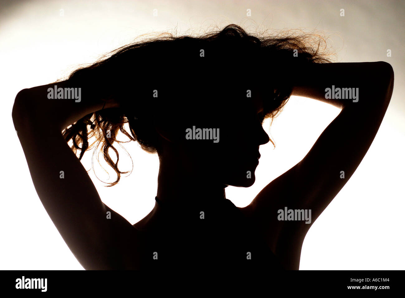 Woman silhouette arms up hi-res stock photography and images - Alamy