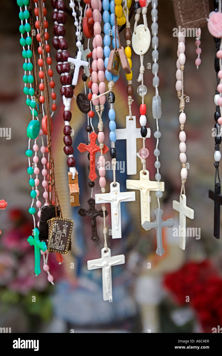 Rosaries candles and religious artifact left by believers at El Santuario de Chimayo Stock Photo
