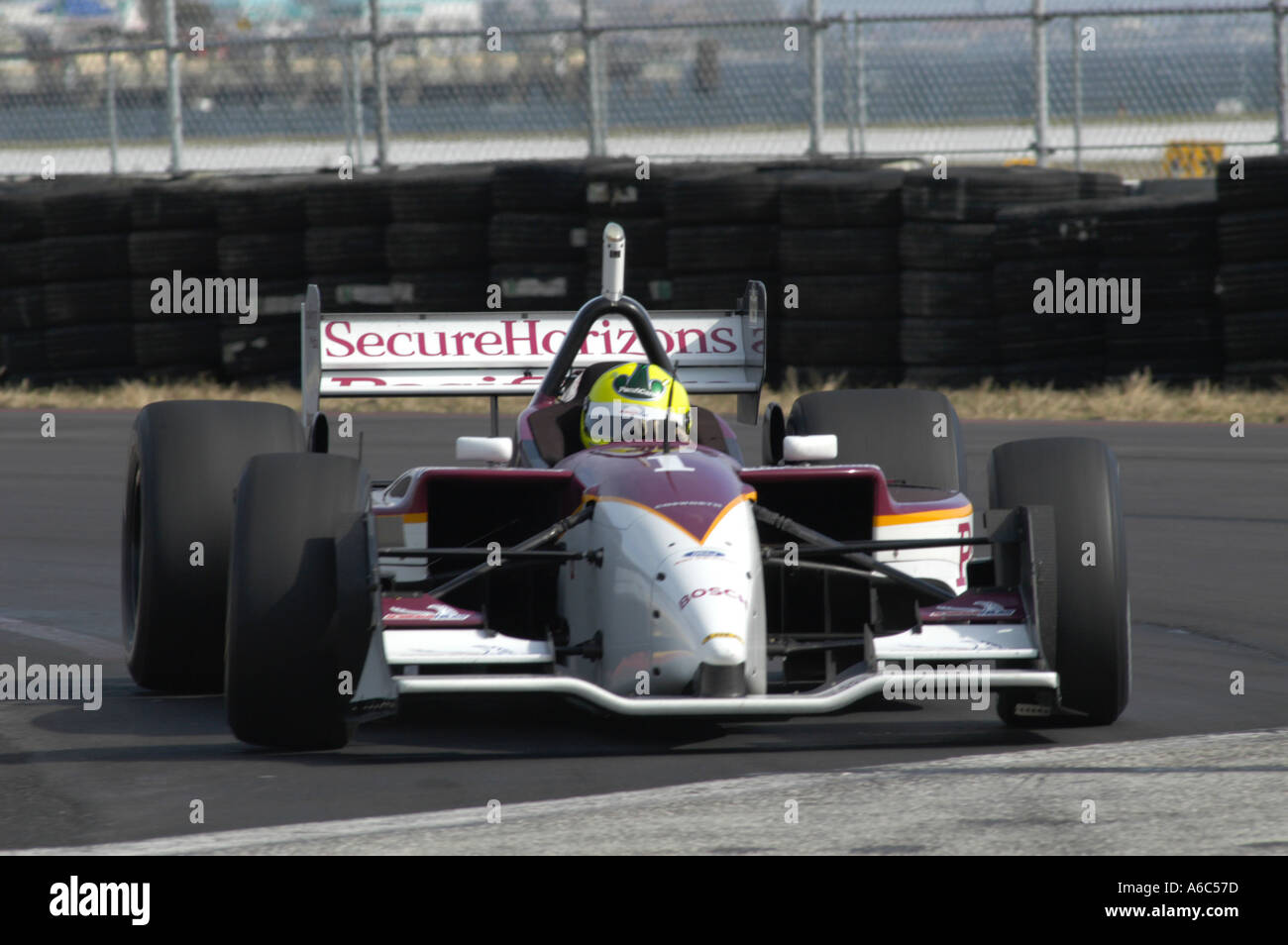 Bruno Junqueira, of Belo Horizonte, Brazil, guides his Ford-Cosworth Lola  for Neman/Haas Racing through the nine turn of the course of the Grand Prix  of Denver with other racers behind him on