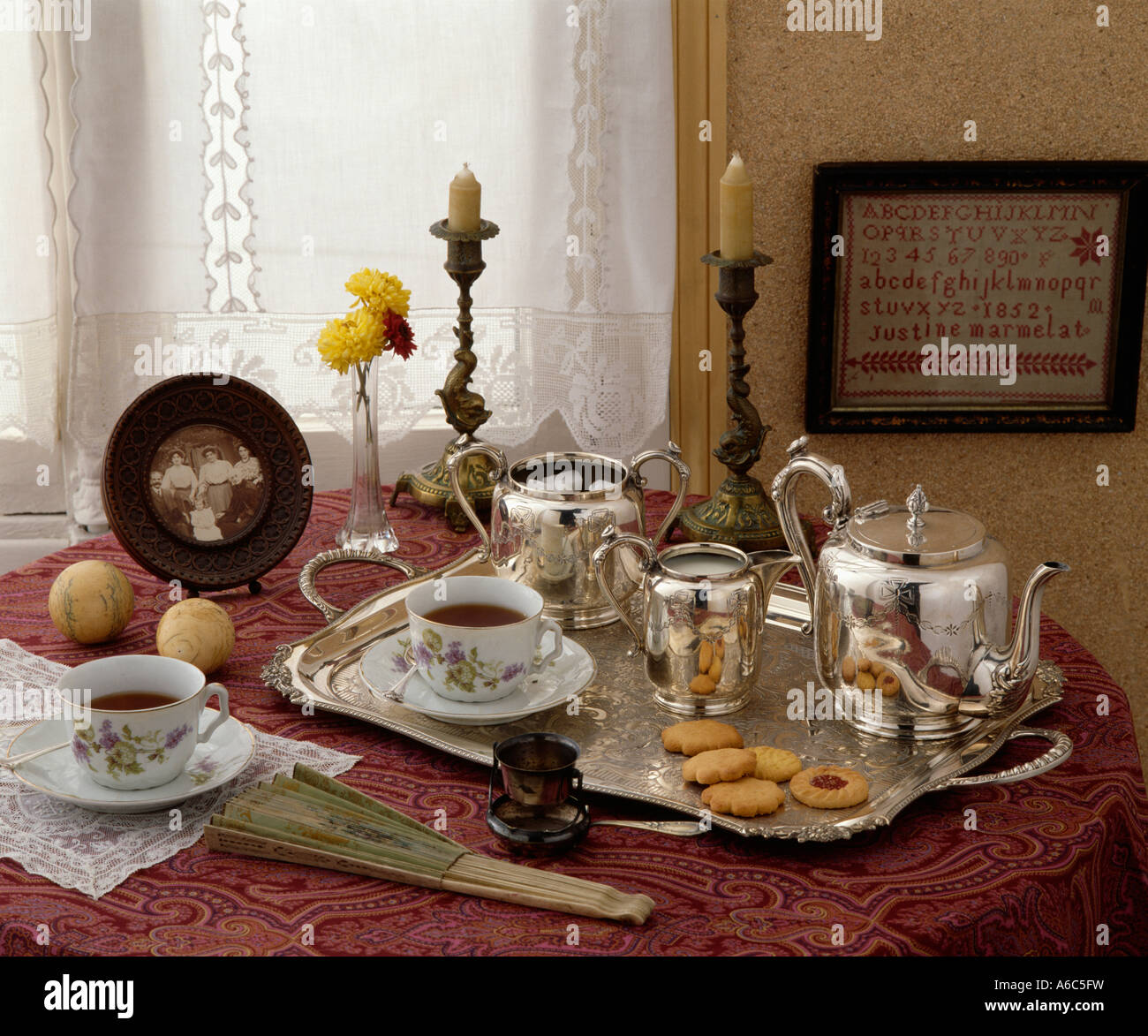 Silver tray set for tea with china cup and saucer and silver teapot and ...
