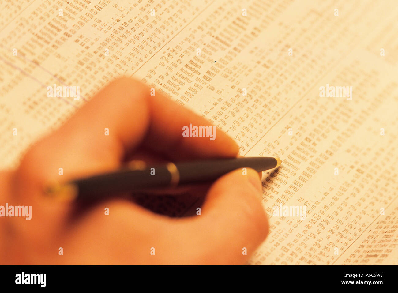 hand-pen-and-stock-quote-pages-stock-photo-alamy