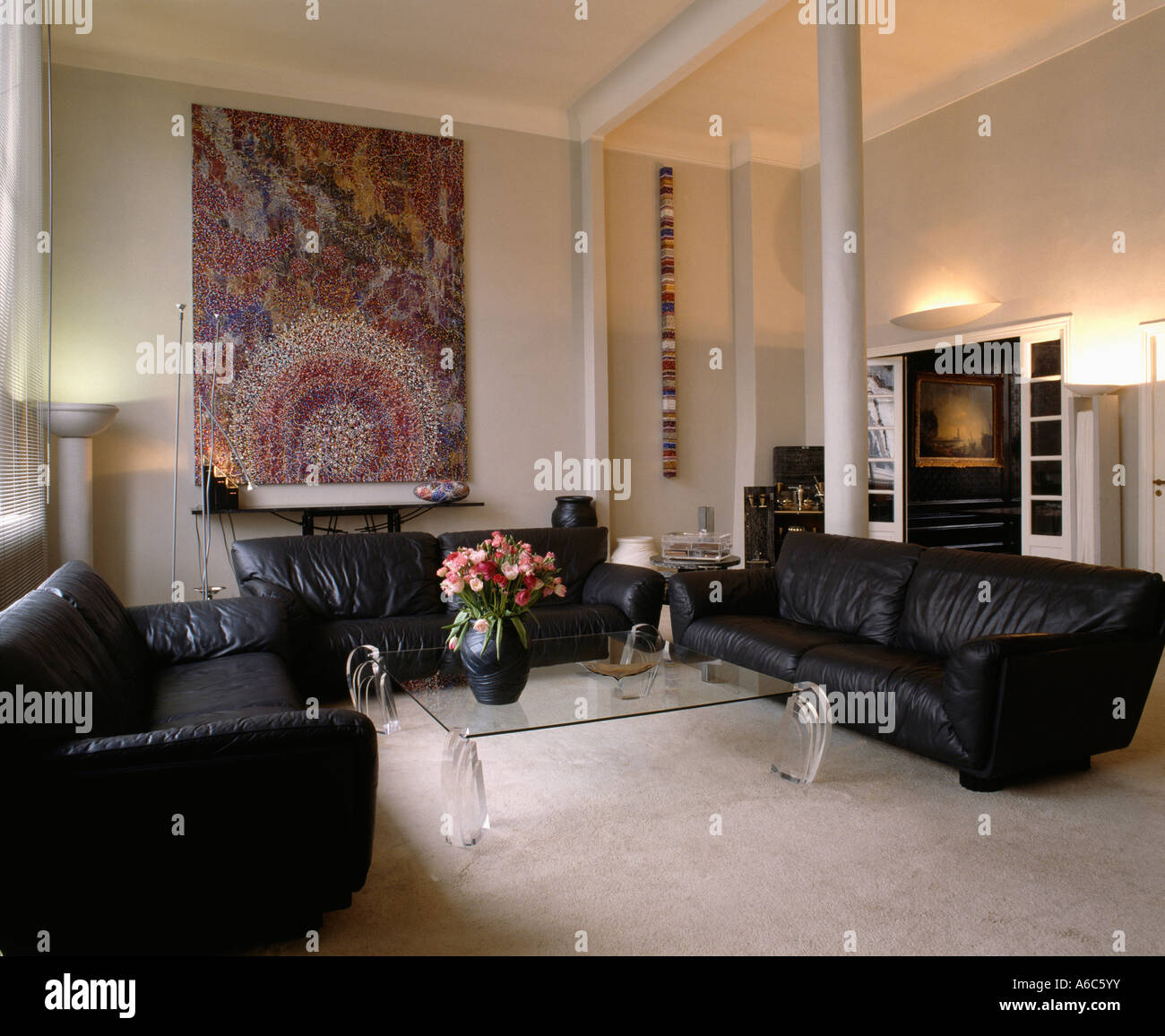 Large Painting On Wall In Modern Sittingroom With Black Leather