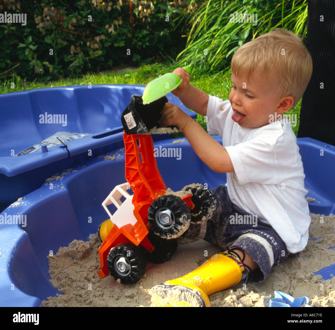 Boy playing sand hi-res stock photography and images - Alamy