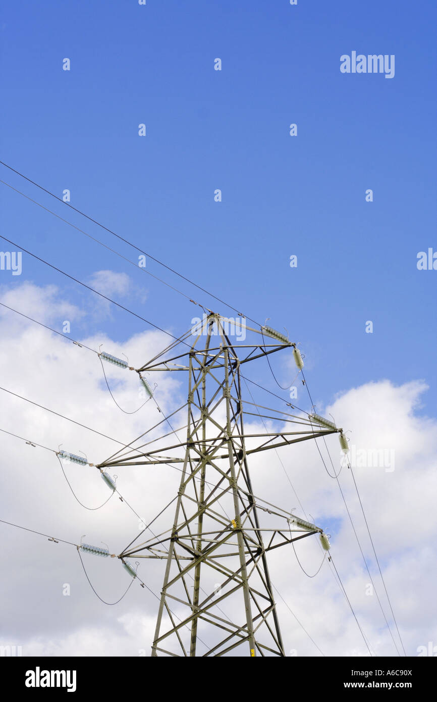 electricity pylon against a bright blue sky Stock Photo - Alamy