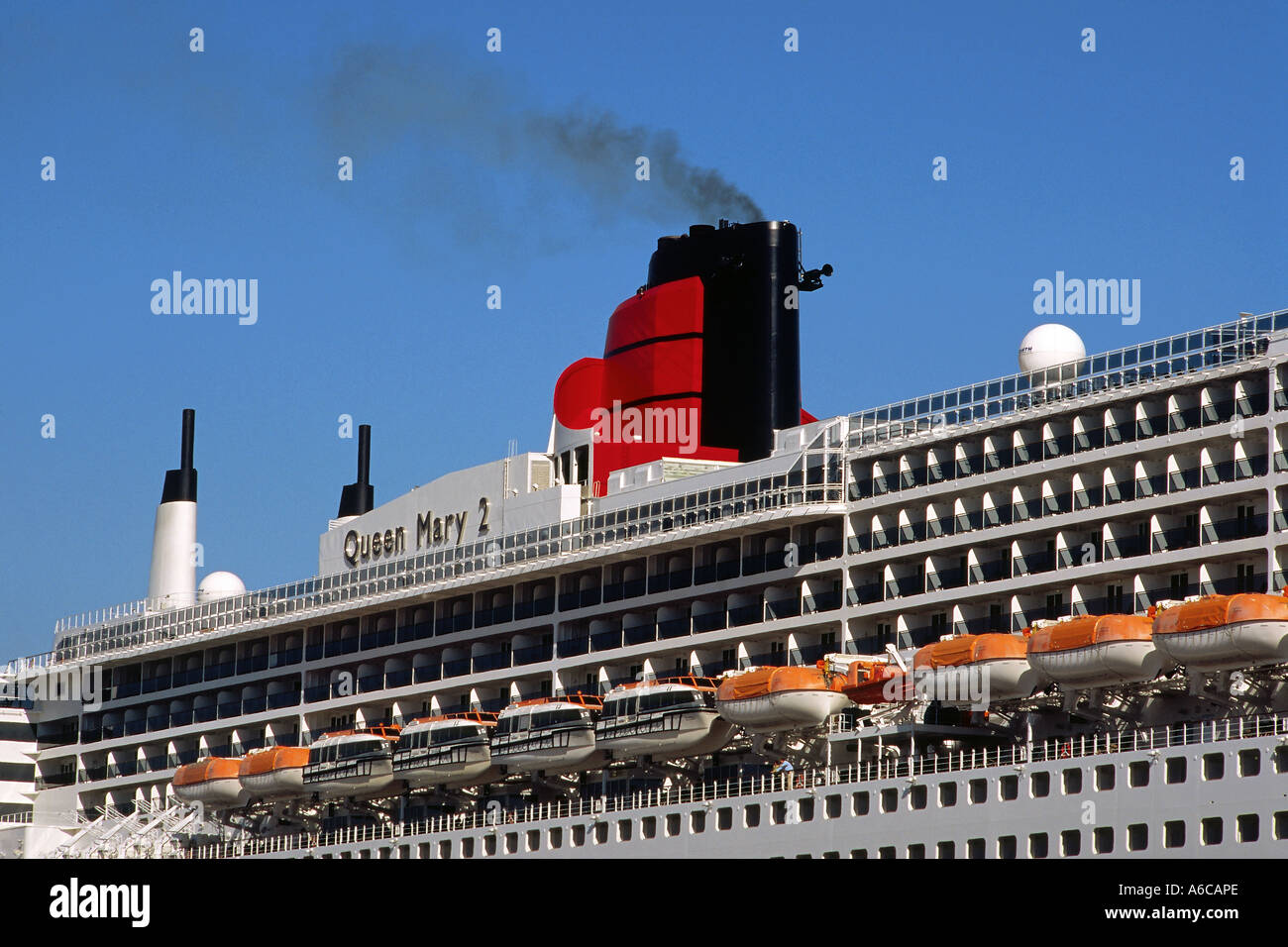 Portion of the Queen Mary 2 as she lays docked at berth 87 in San Pedro harbor, California Stock