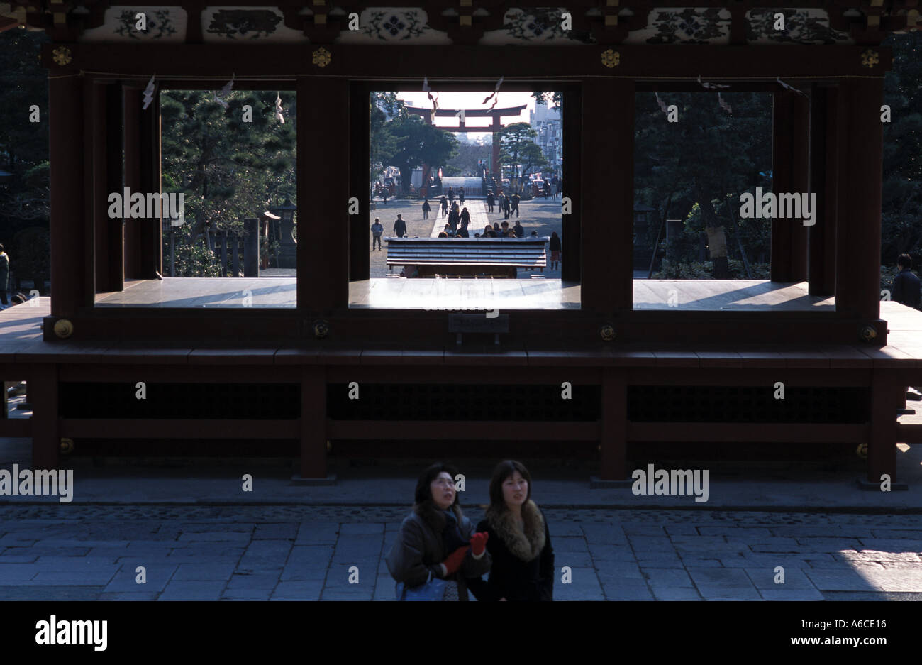 People stand by the ritual dance stage of the Hachimangu shrine in ...