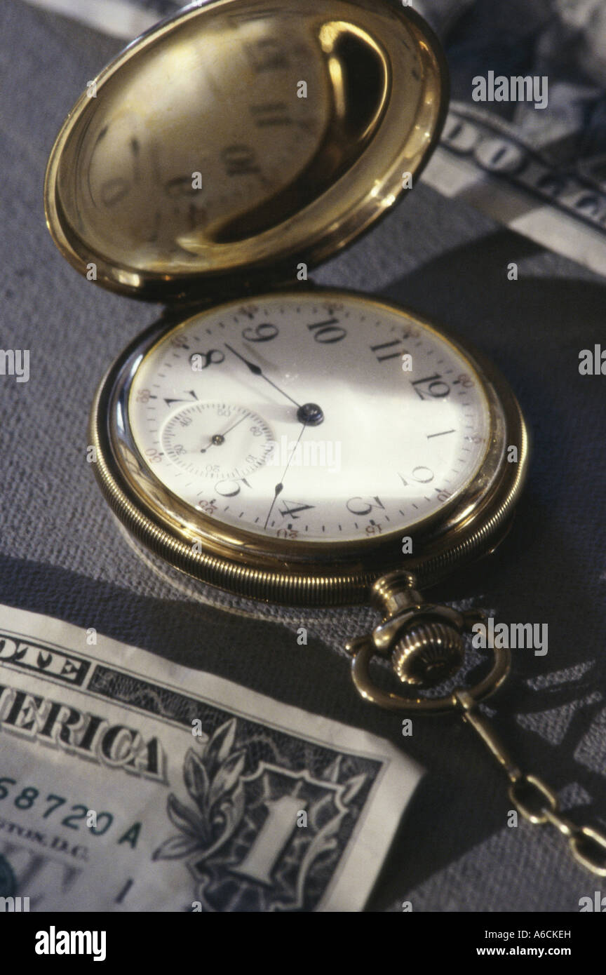 Pocket watch near American dollar bills Stock Photo Alamy