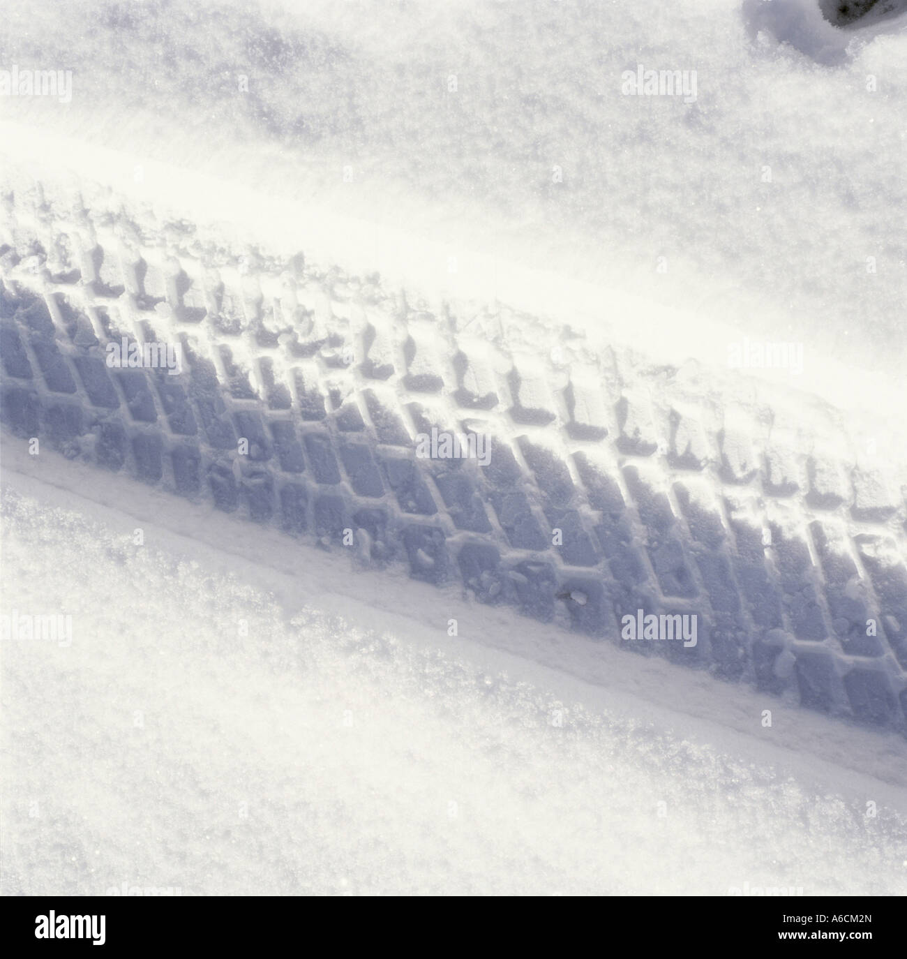 Tire tracks in the snow Stock Photo - Alamy
