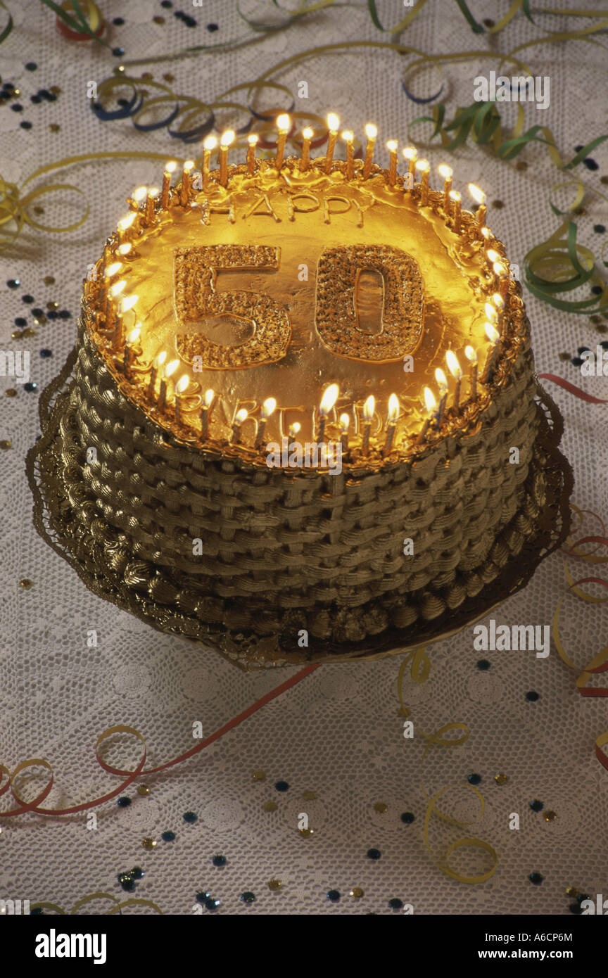 Birthday cake with lit candles Stock Photo - Alamy