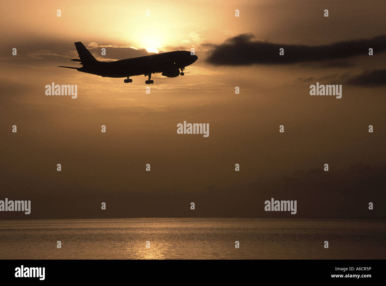 Silhouette of an airplane flying in the sky Stock Photo - Alamy